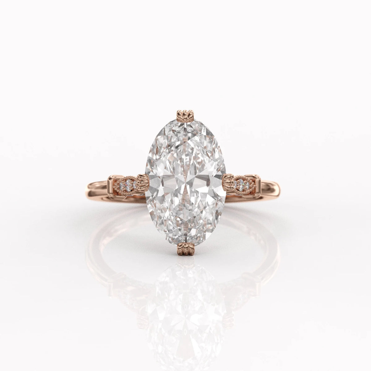 Front view of a 4 CT oval lab created diamond ring set in 14K rose gold with decorative textured prongs.
