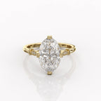 Top view showing brilliant 4 carat oval lab grown diamond set in yellow gold with accent side stones.