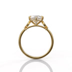 Side profile view of a 3 CT marquise lab grown diamond engagement ring in yellow gold showing gallery structure and band profile.