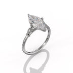 Angle view of a 3 CT marquise lab grown diamond engagement ring crafted in white gold with vintage leaf side details.