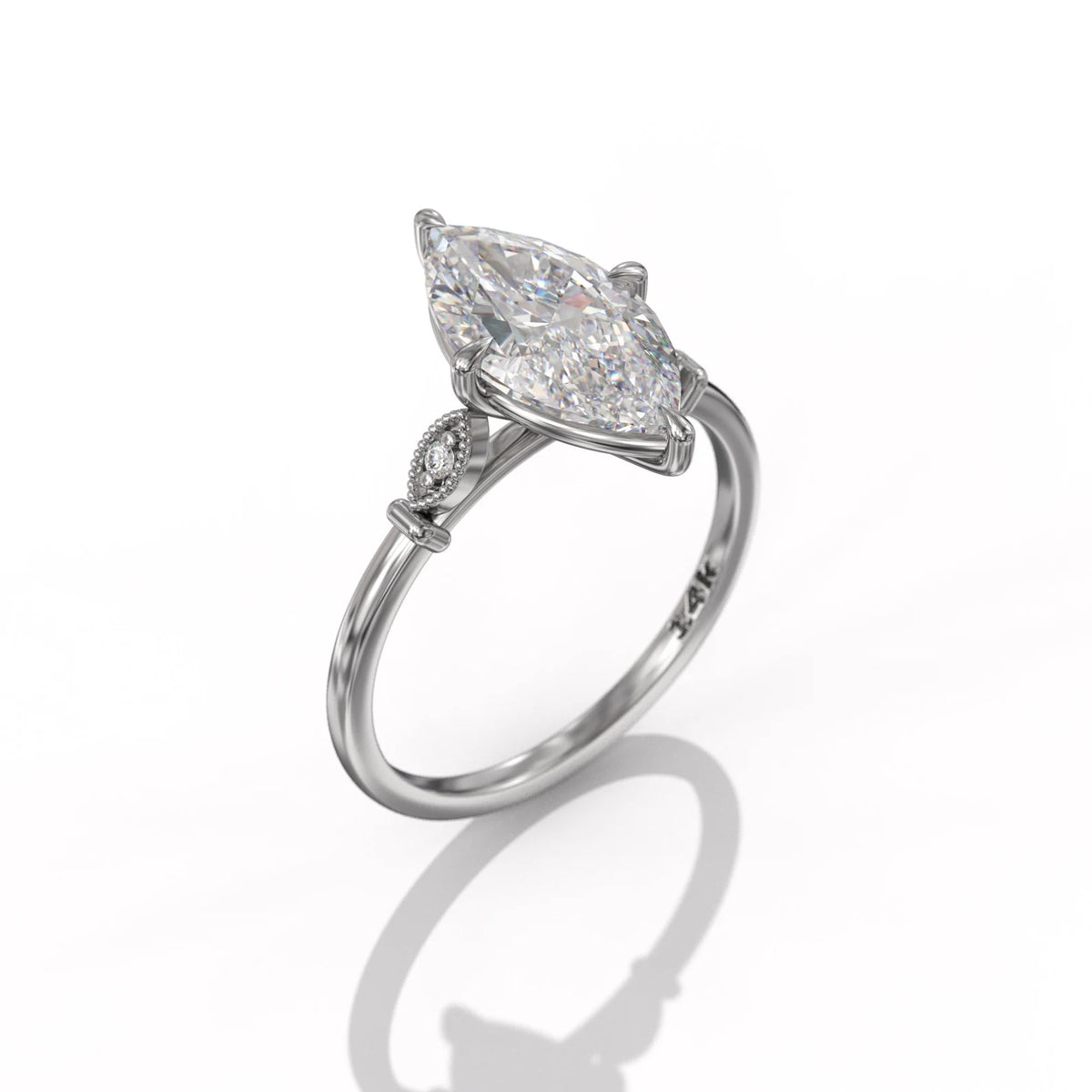 Angle view of a 3 CT marquise lab grown diamond engagement ring crafted in white gold with vintage leaf side details.