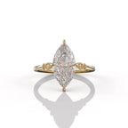 Top-down view of a 3 carat marquise lab grown diamond engagement ring in yellow gold showcasing brilliant cut facets and 6-prong setting.
