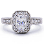 Top view of a 3 CT radiant lab grown diamond engagement ring with vintage milgrain halo and accent diamond band.