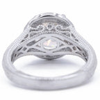 Underside profile view of a 3 CT round lab grown diamond engagement ring displaying filigree scrollwork and milgrain gallery detailing.
