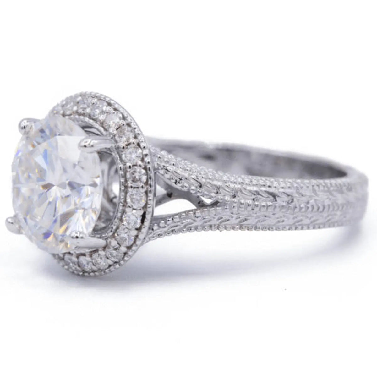 Side view of a round lab grown diamond ring showcasing split-shank transition and hand-carved chevron engraving.