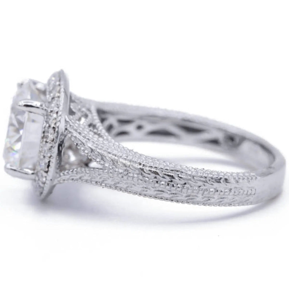 Profile view of a white gold 3 CT round lab diamond engagement ring with double milgrain borders and engraved patterns.