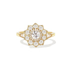 Studio portrait of a 1.5 carat round lab created diamond flower halo engagement ring set in 14K yellow gold.