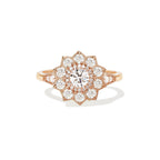 Studio portrait of a 1.5 CT round lab grown diamond starburst floral halo engagement ring in solid rose gold.