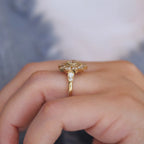 Side angle profile view on hand showing the height and milgrain shoulder detail of a 1.5 carat round lab diamond starburst ring.