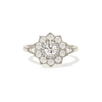 Studio portrait of a 1.5 CT round lab grown diamond starburst floral halo ring in white gold or platinum setting.