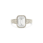 Studio product shot of a 3 CT emerald cut lab grown diamond engagement ring with floral milgrain bezel in white gold or platinum.