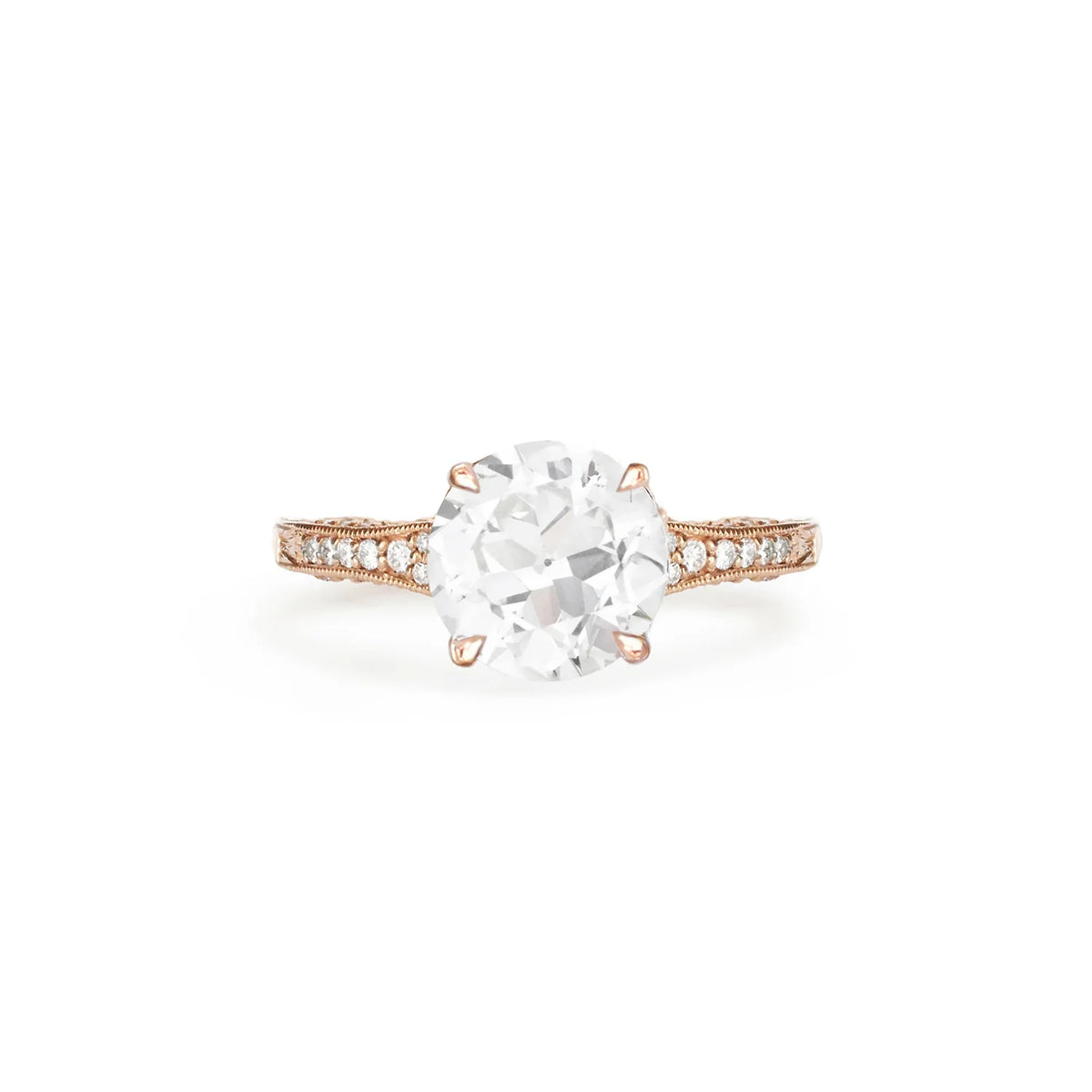 Studio product shot of a 2 CT round lab grown diamond engagement ring with filigree basket in rose gold.