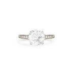 Studio product shot of a 2 carat round lab created diamond vintage filigree ring in solid white gold or platinum.