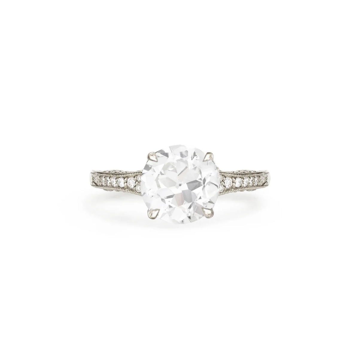 Studio product shot of a 2 carat round lab created diamond vintage filigree ring in solid white gold or platinum.