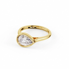 Three-quarter angled perspective shot of a 2 carat East-West pear cut lab grown diamond engagement ring in polished yellow gold bezel.