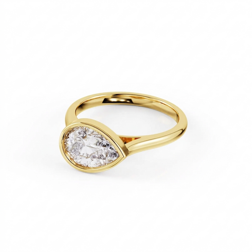 Three-quarter angled perspective shot of a 2 carat East-West pear cut lab grown diamond engagement ring in polished yellow gold bezel.