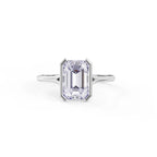Top down view of a 3 carat emerald cut lab grown diamond set in a white gold half bezel frame ring.