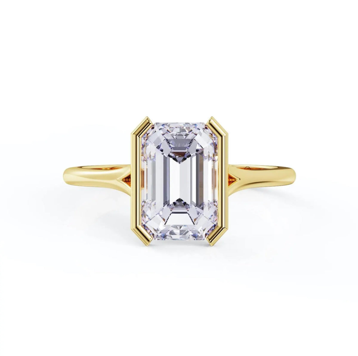 Top view of a 3 carat emerald cut lab grown diamond in a polished yellow gold half-bezel solitaire setting.