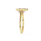 Side edge view of a yellow gold half bezel ring showing the band and profile of a 3ct emerald lab diamond.