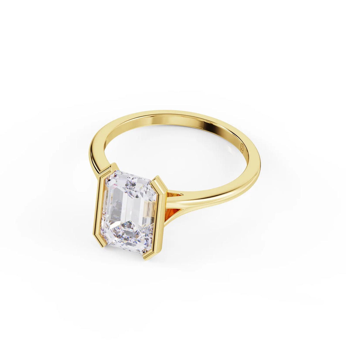 Three-quarter angle perspective of a 3 carat emerald cut lab grown diamond solitaire ring in yellow gold.