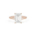 Front studio view of a 3 CT emerald cut lab created diamond ring in rose gold showing hand-carved floral shoulders with pavé diamond accents.