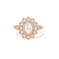 Front studio shot of a 2 CT oval lab created diamond sunburst halo engagement ring in rose gold.