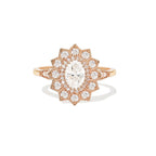Front studio shot of a 2 CT oval lab created diamond sunburst halo engagement ring in rose gold.