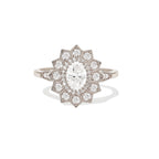 Studio view of a 2 CT oval lab grown diamond engagement ring with a vintage starburst halo setting in white gold.