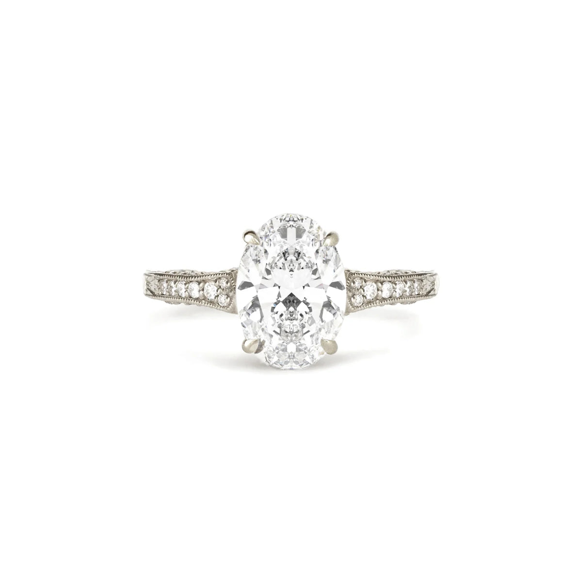 Front studio image of a 2 CT oval lab created diamond ring with vintage milgrain detailing in white gold.