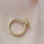 Full circular view of a 2 CT oval diamond ring highlighting hand-engraved side scrollwork on satin.