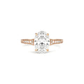 Studio front view of a 2 CT oval lab diamond engagement ring with engraved band in rose gold.