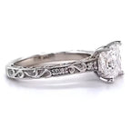 Side profile of a 2.5 CT princess cut lab grown diamond ring showing intricate filigree scroll engraving and accent diamonds set in 14K white gold.