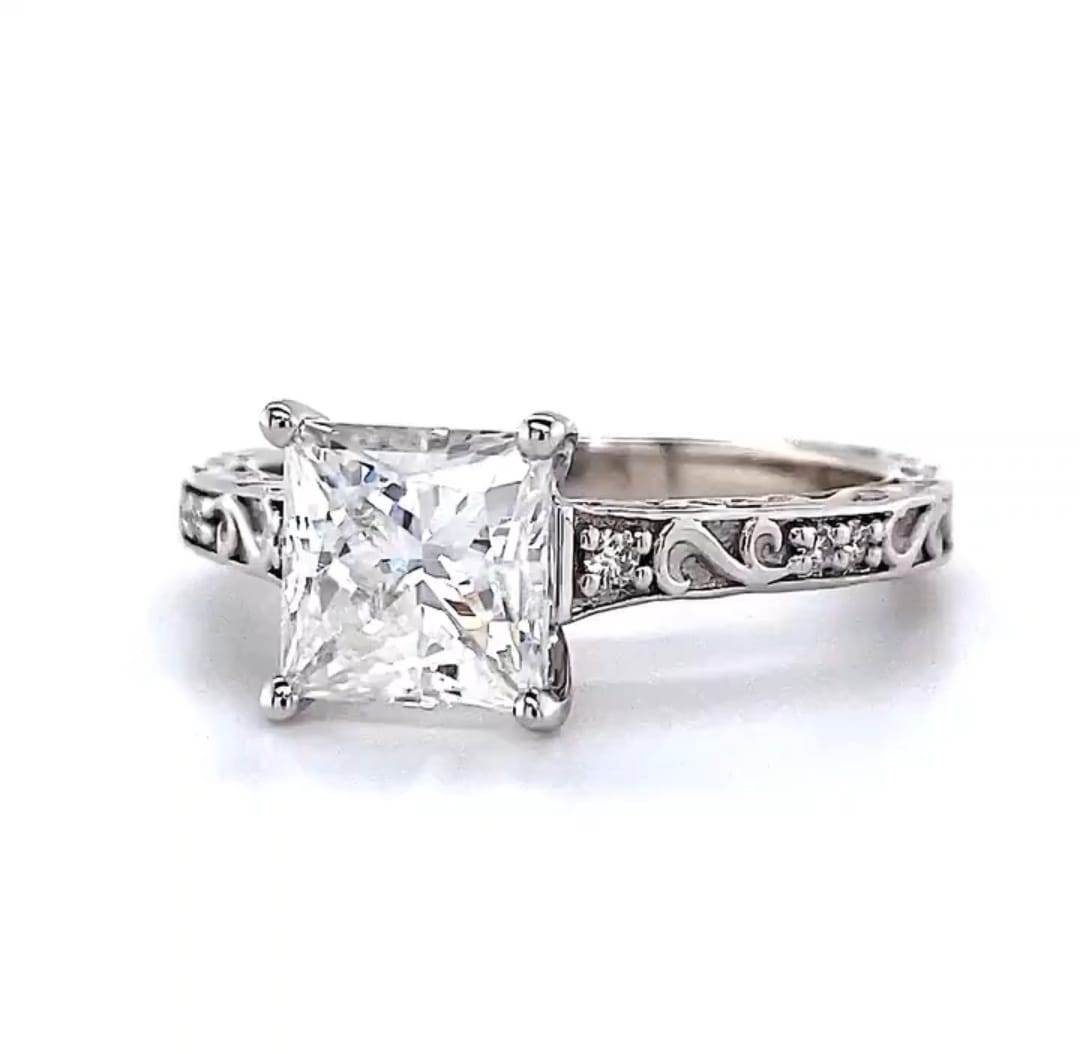 Three-quarter angled view of 2.5 CT lab created princess cut diamond solitaire ring featuring antique scrollwork and micro accent diamonds.