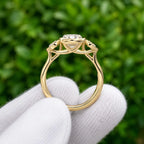 Side profile view of yellow gold bezel set 3 CT oval lab diamond ring displaying open cathedral basket setting.