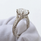 Side profile view of 4 CT marquise lab grown diamond ring showing hand-engraved scrollwork and cathedral setting on white gold band.