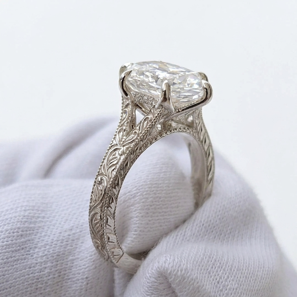 Side profile view of 4 CT marquise lab grown diamond ring showing hand-engraved scrollwork and cathedral setting on white gold band.