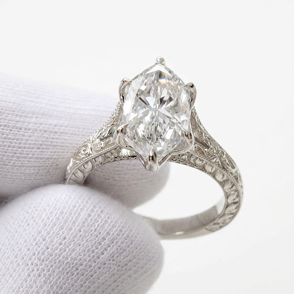 Three-quarter view of a 4 CT marquise cut lab grown diamond engagement ring with antique carved band in 14K white gold.