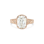 Rose gold 3 CT elongated cushion cut lab diamond engagement ring with floral hand-engraved band.
