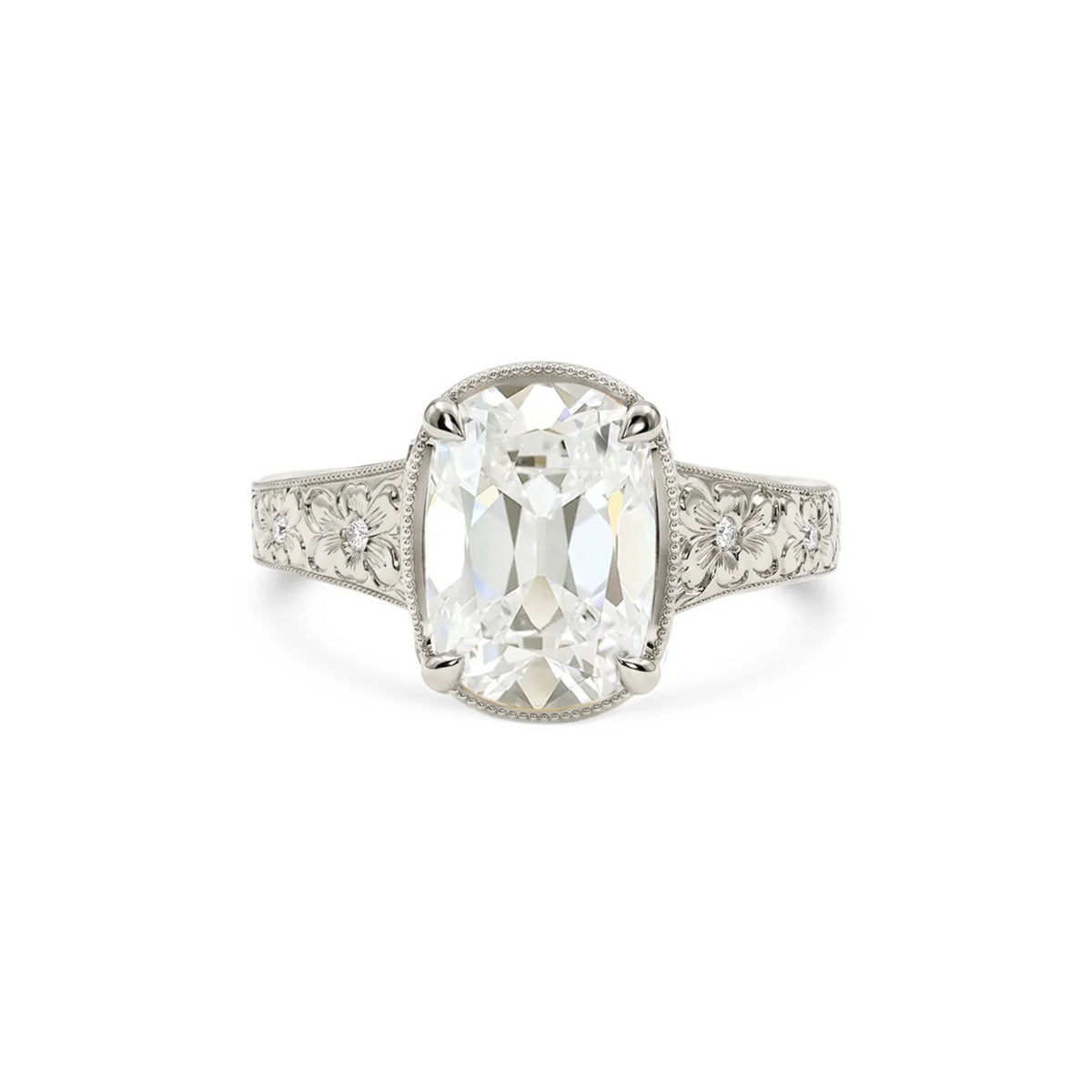 White gold 3 carat elongated cushion lab created diamond ring with vintage floral motif shank.
