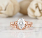 2 CT oval cut lab grown diamond bridal ring set in romantic rose gold with antique engraved filigree band.