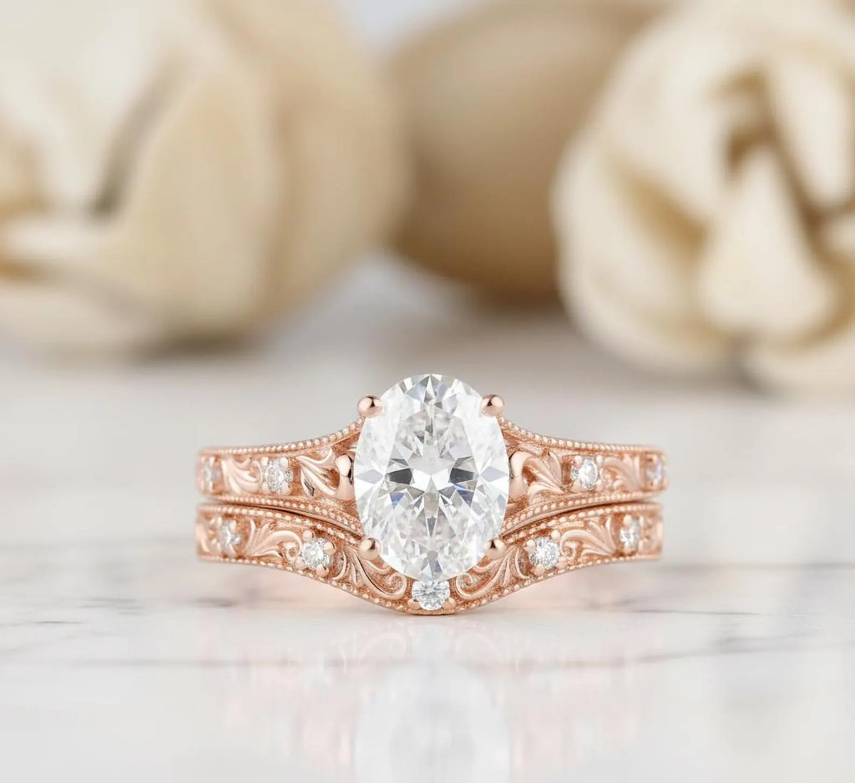 2 CT oval cut lab grown diamond bridal ring set in romantic rose gold with antique engraved filigree band.