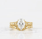 Front view of yellow gold 2 CT oval lab grown diamond ring with matching contoured filigree bridal band.