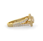 Side view of a yellow gold 2 carat round lab grown diamond engagement ring with double pavé split shank.