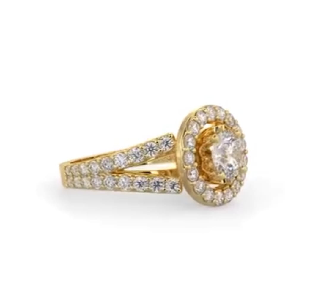 Three-quarter view of a 2ct round lab diamond halo ring featuring a double row pave split band in yellow gold.