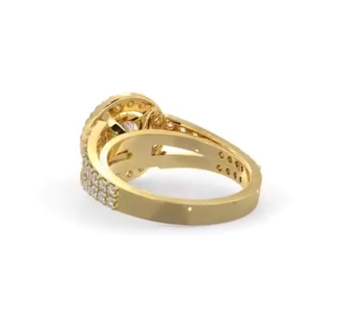 Rear perspective showing the smooth yellow gold lower shank and split band transition of a halo diamond ring.
