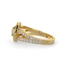 Angled side profile showing the layered halo setting and pavé split shank of a round lab diamond ring.