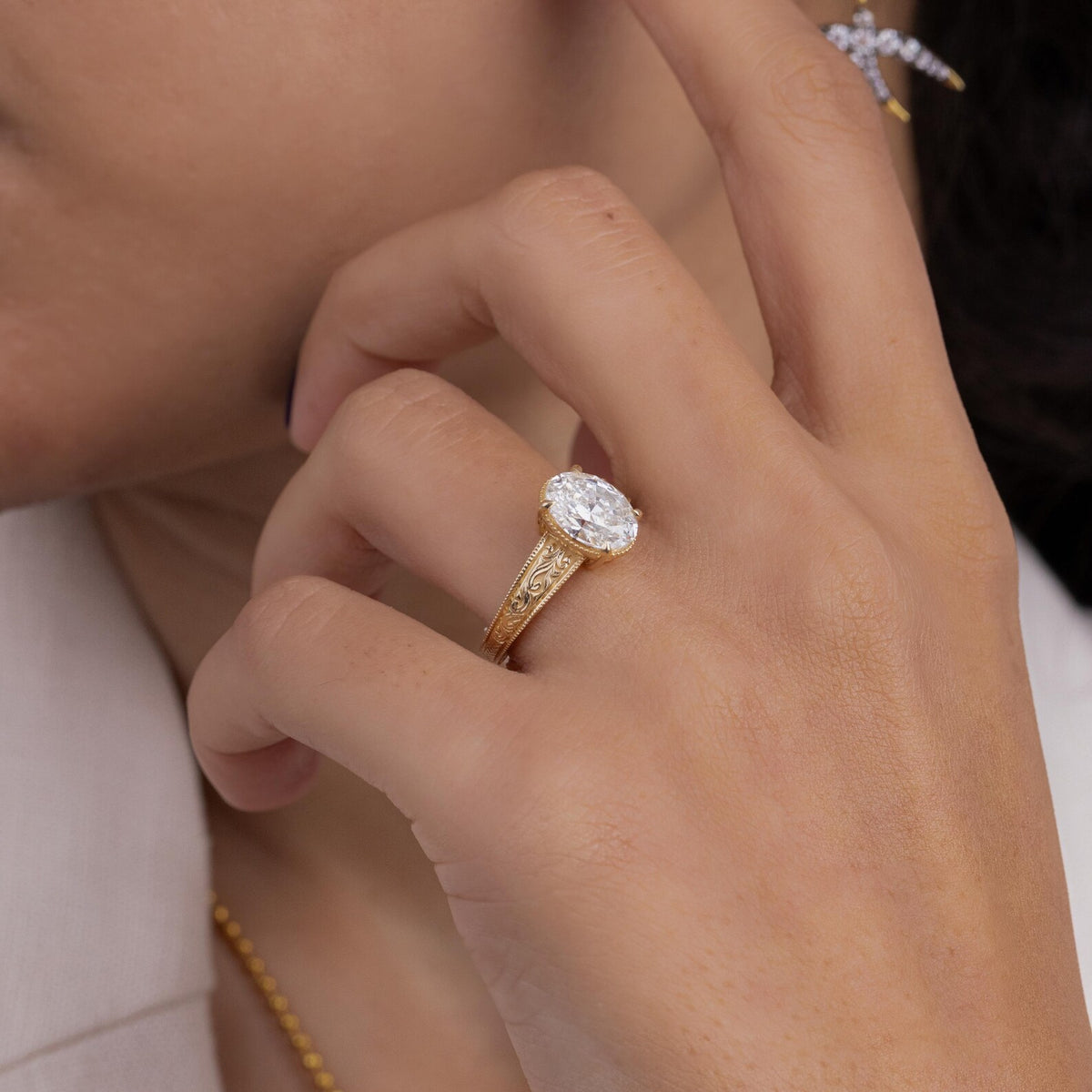 Back view showing the undergallery basket and interior band of a 2 CT oval lab diamond ring.