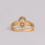 Back view showing the undergallery basket and interior band of a 2 CT oval lab diamond ring.