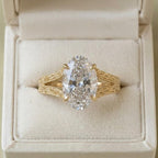 Elegant close-up of the 4 ct oval lab grown diamond ring resting gracefully inside a luxury presentation jewelry box.