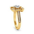Three-quarter angle view of a 2 carat round lab-grown diamond ring featuring a scalloped vintage floral halo in yellow gold.